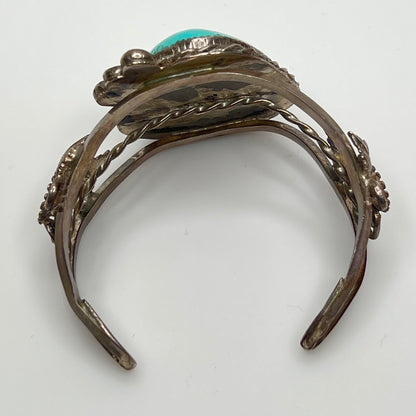Vintage Native American turquoise and sterling silver cuff bracelet with floral motif
