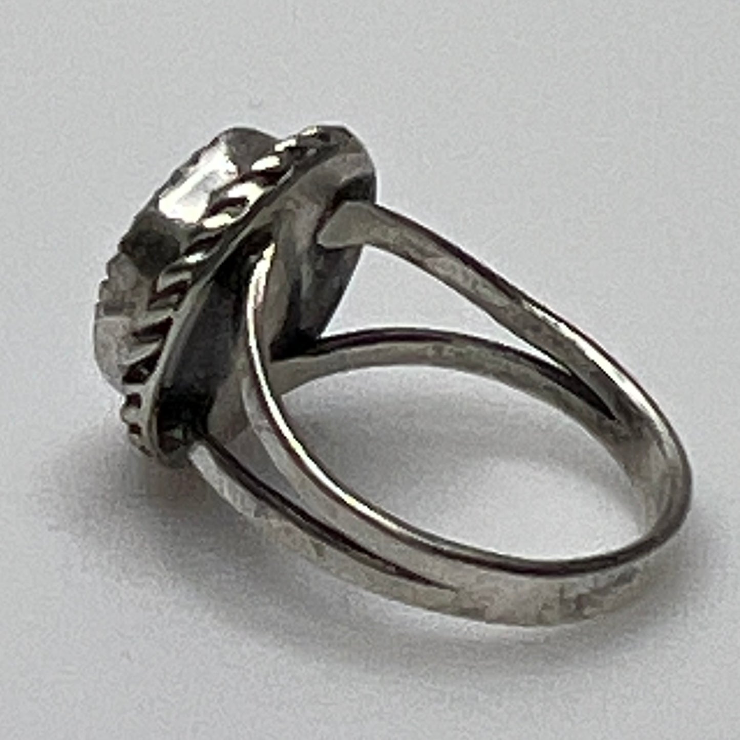 Side view of split shank turquoise ring in silver setting