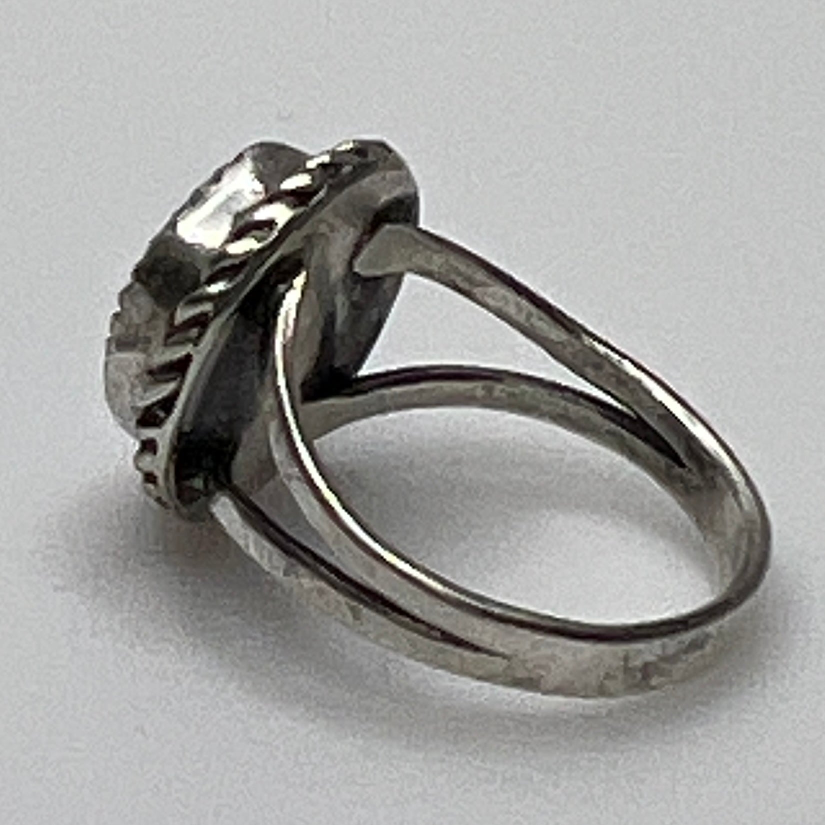 Side view of split shank turquoise ring in silver setting