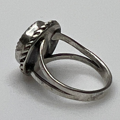 Side view of split shank turquoise ring in silver setting