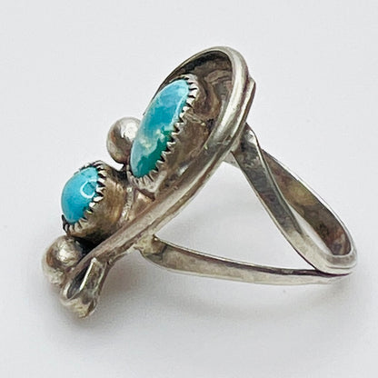 Side view of split shank silver ring with turquoise stones