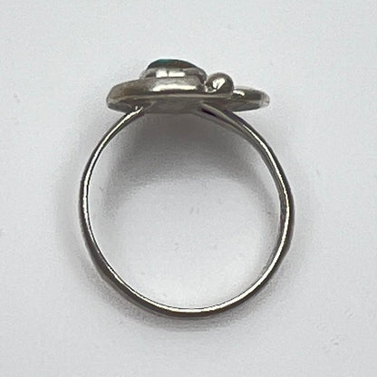 Close-up of turquoise ring showing rope and leaf motif