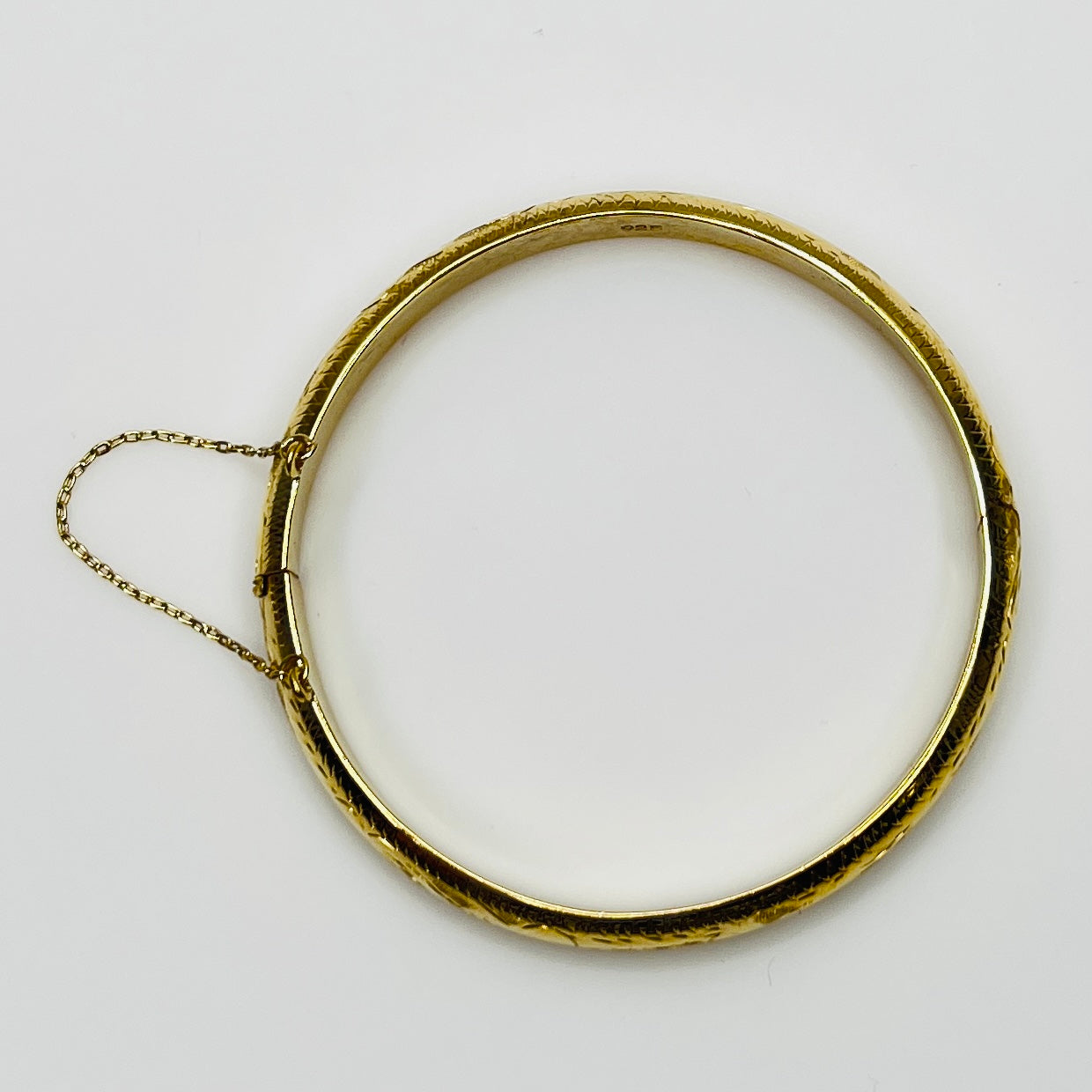 Full view of bracelet with safety chain, laying flat