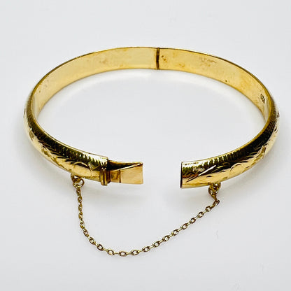 Full view of bracelet with safety chain, laying flat