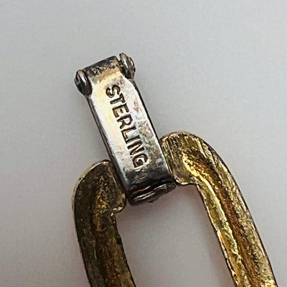 Close-up of sterling stamp on fold-over clasp