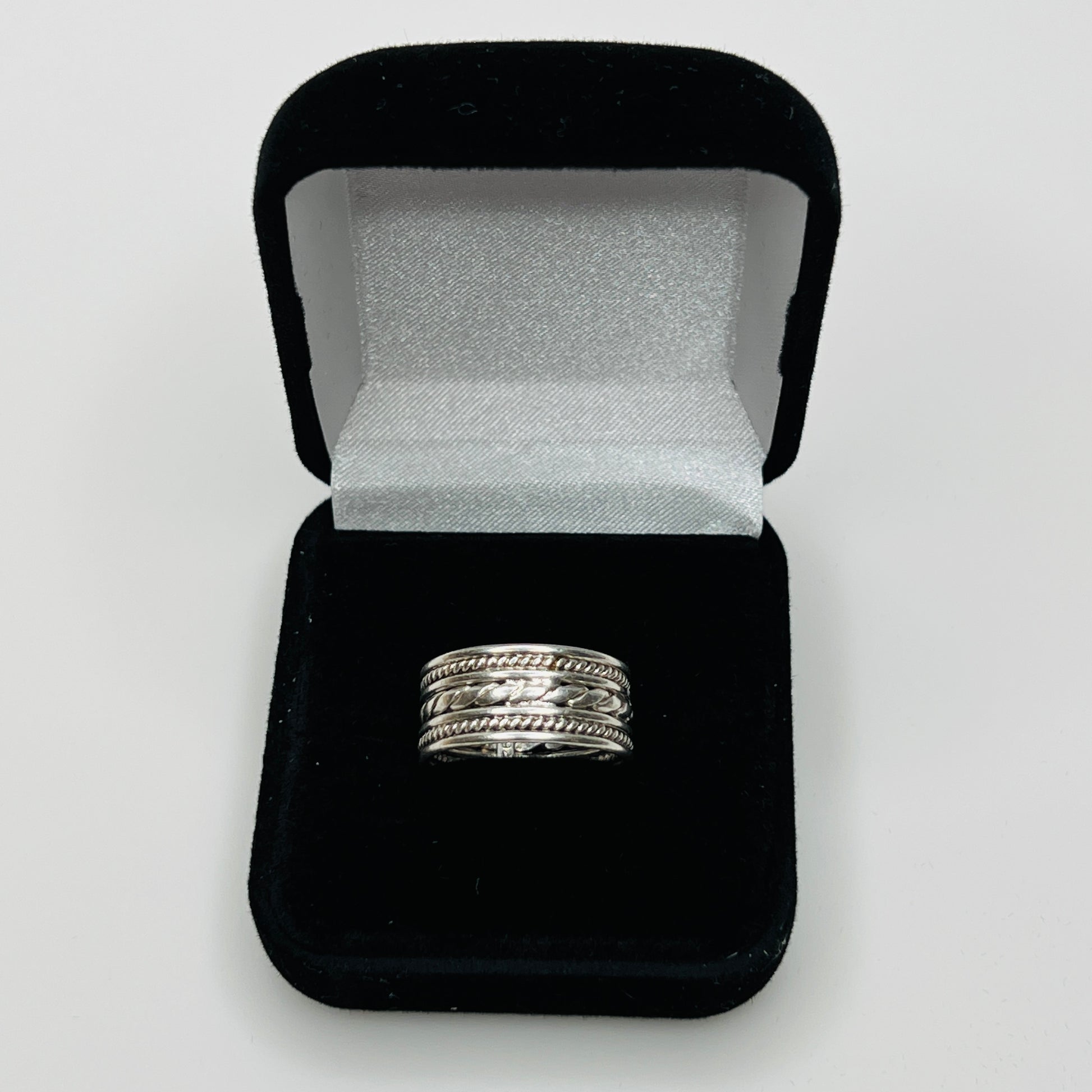 Close-up of textured braid and rope design on ring band