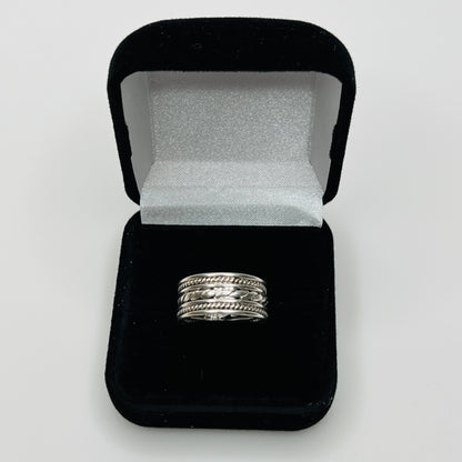 Close-up of textured braid and rope design on ring band