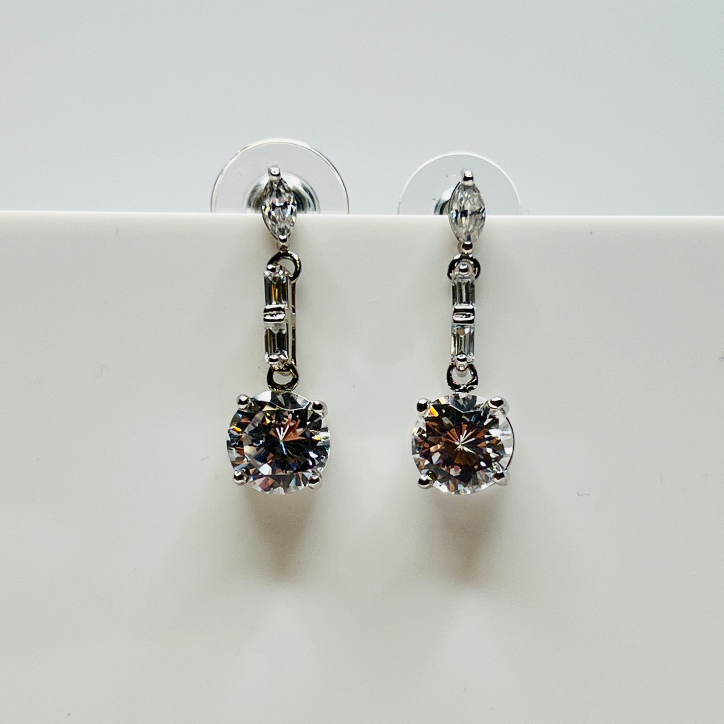 Sterling silver rhinestone dangle earrings with marquise, baguette, and round crystal