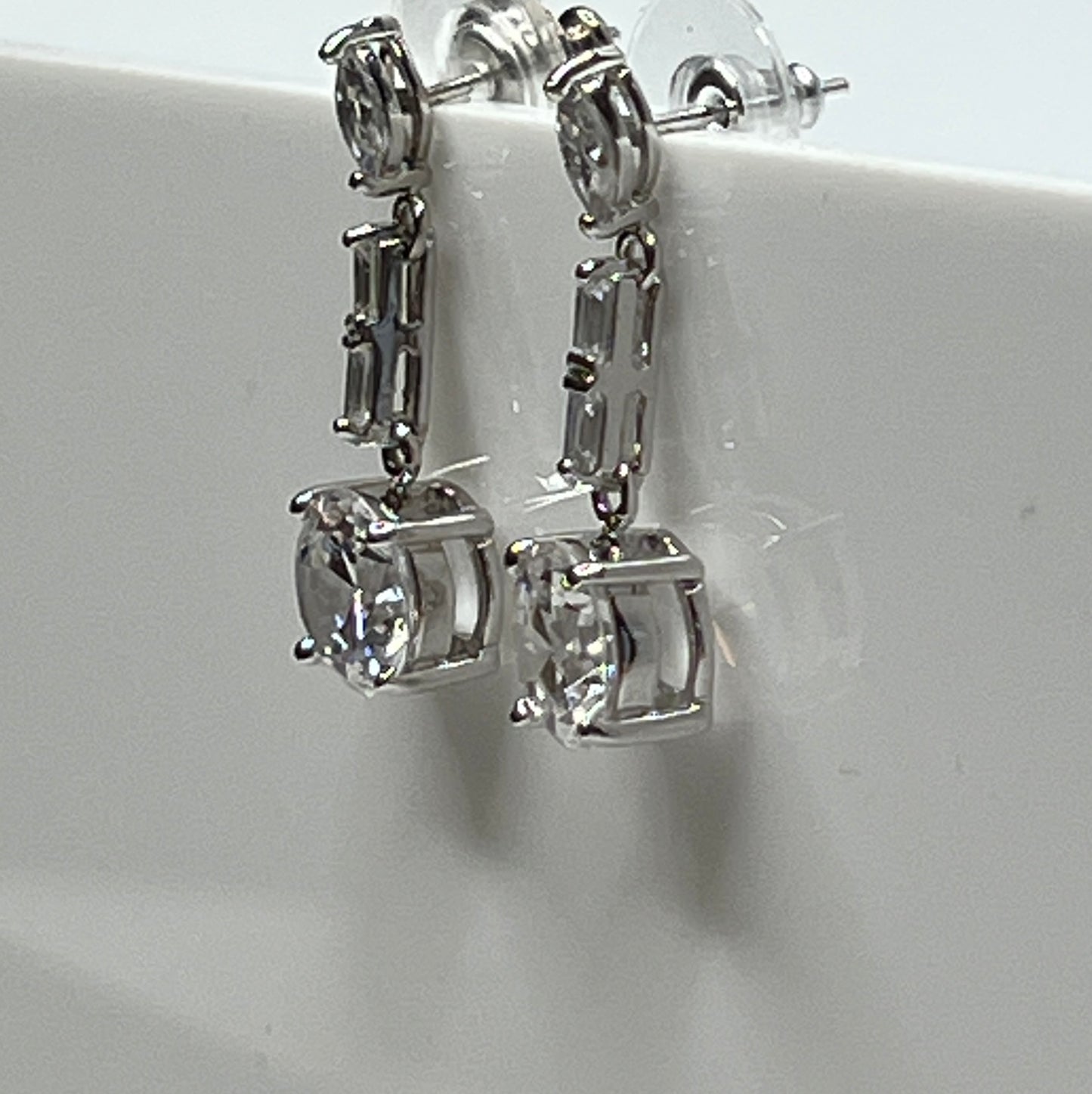 Suzanne Somers 925 earrings with clear rhinestones in prong and bar settings