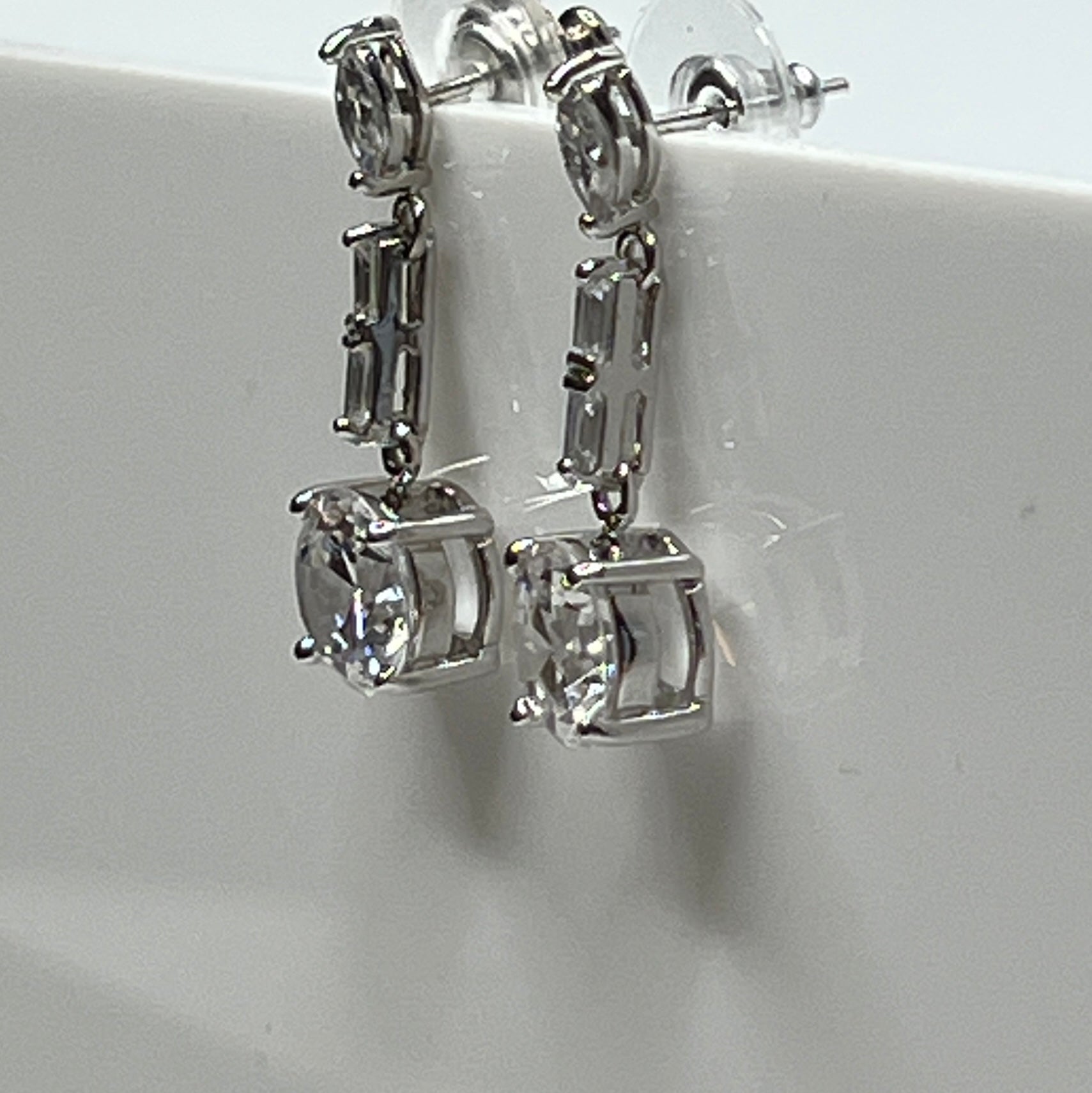 Suzanne Somers 925 earrings with clear rhinestones in prong and bar settings
