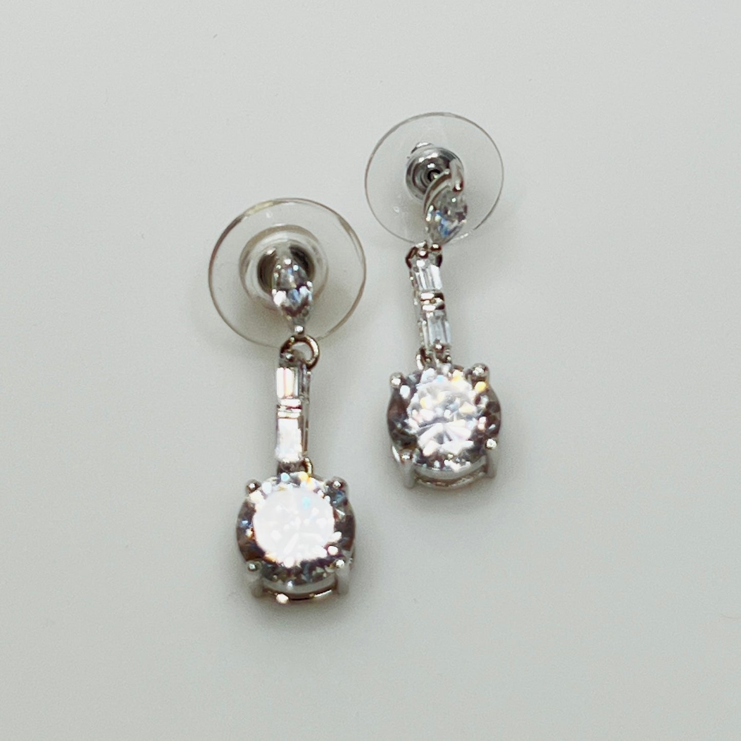 Suzanne Somers 925 earrings with clear rhinestones in prong and bar settings