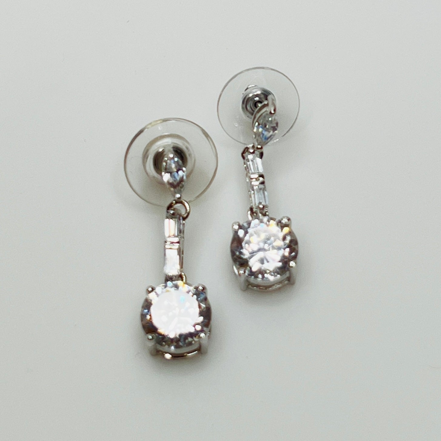 Suzanne Somers 925 earrings with clear rhinestones in prong and bar settings