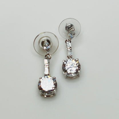 Suzanne Somers 925 earrings with clear rhinestones in prong and bar settings