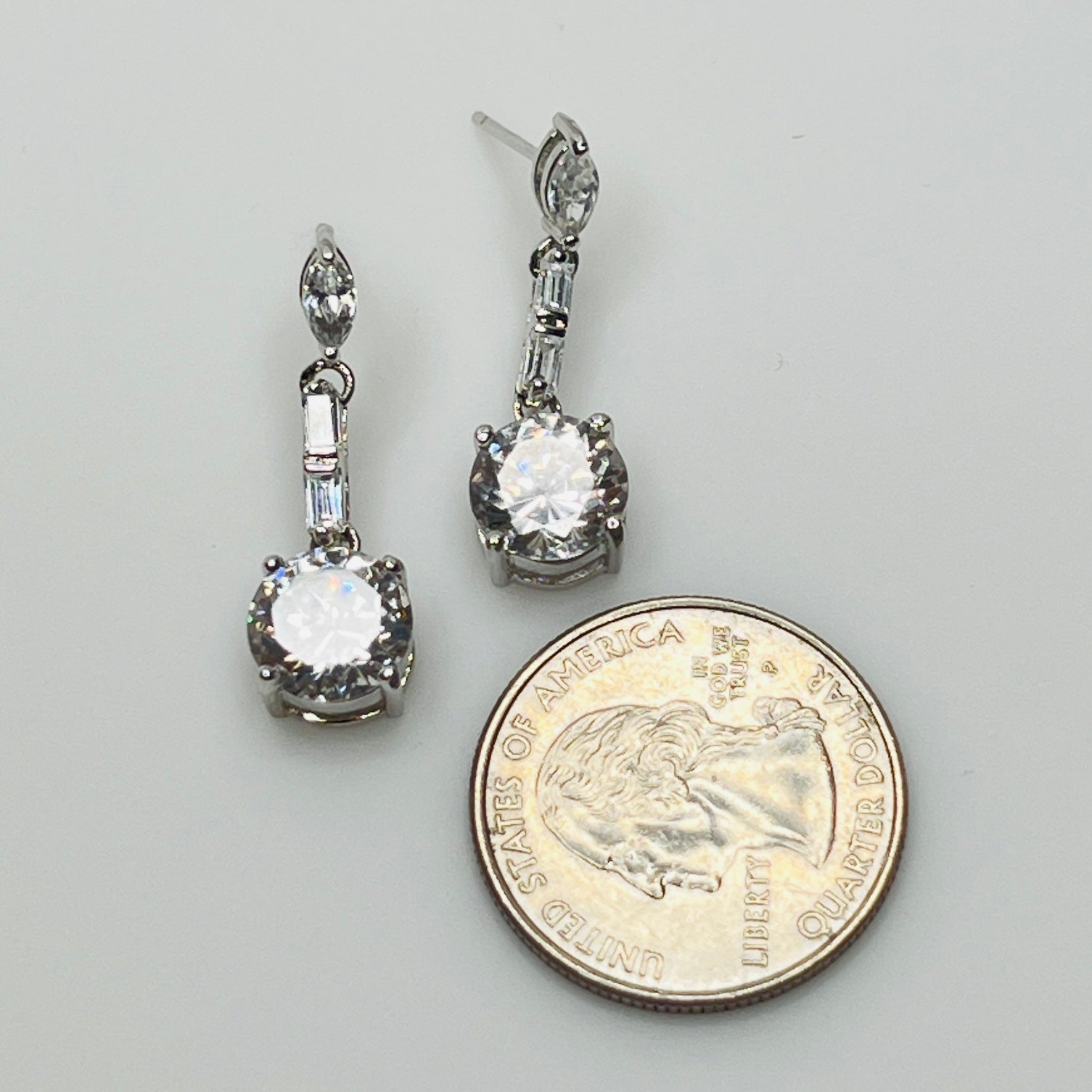 Suzanne Somers 925 earrings with clear rhinestones in prong and bar settings
