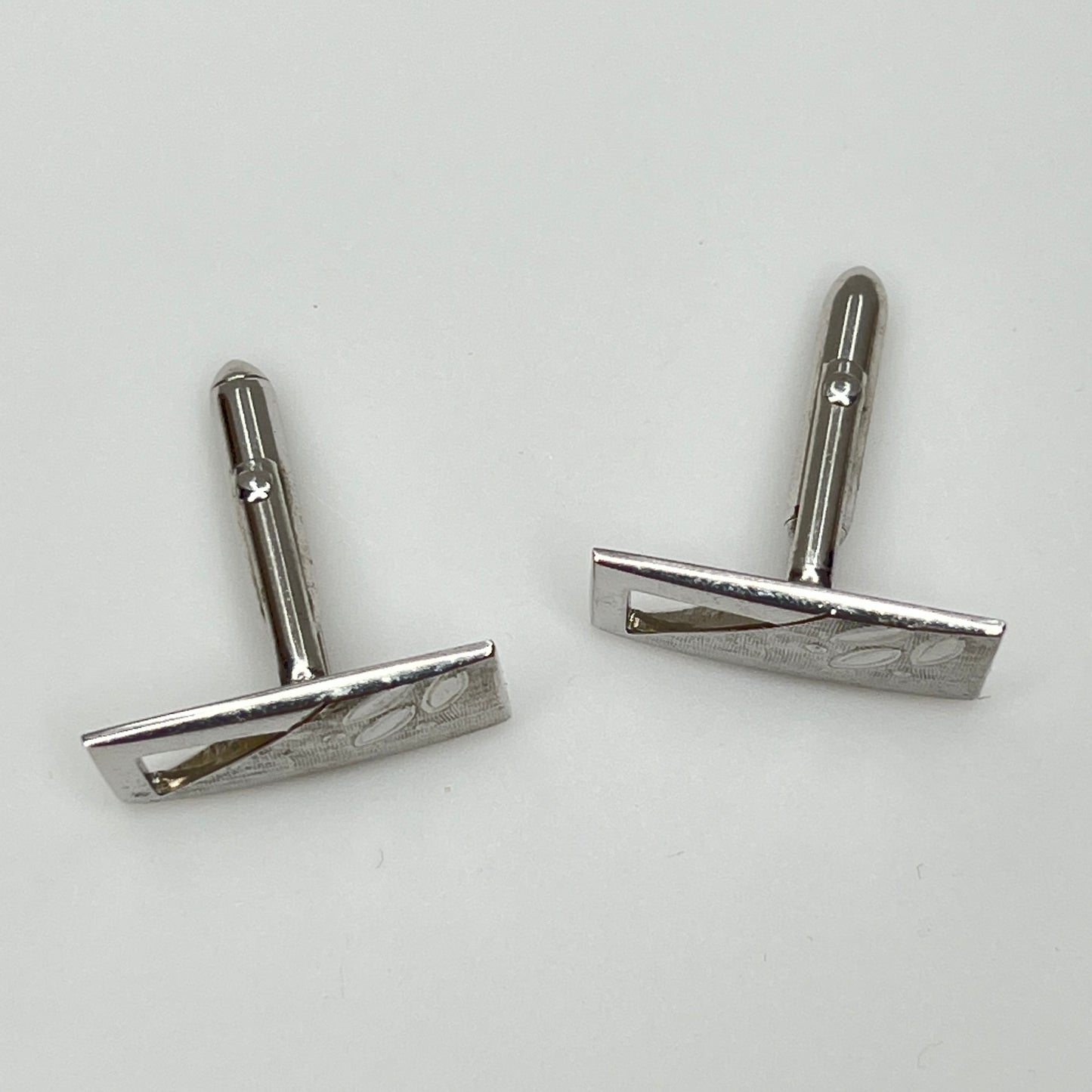 Silver-tone rectangular Swank cufflinks with Art Deco leaf and dot motif, mid-century vintage