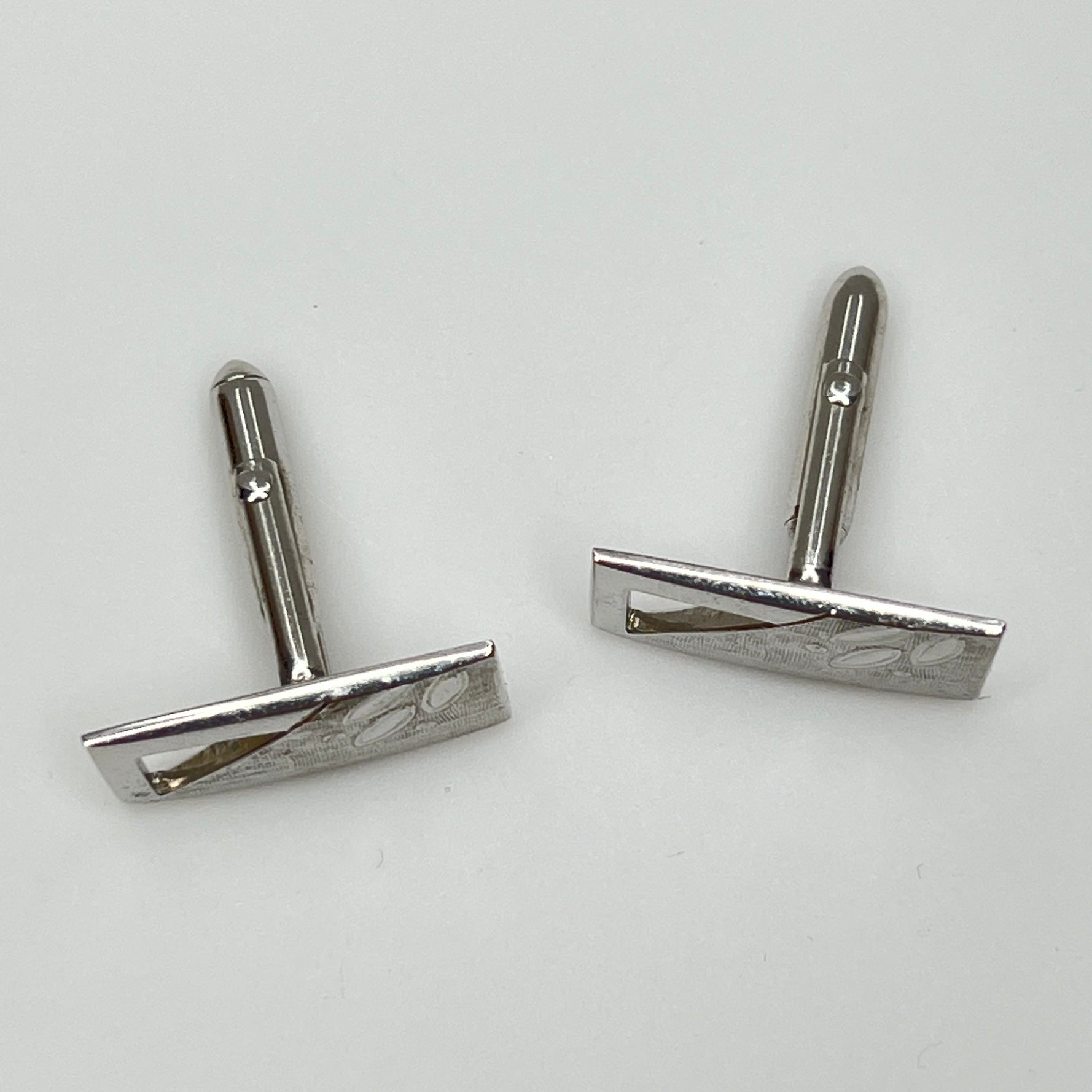 Silver-tone rectangular Swank cufflinks with Art Deco leaf and dot motif, mid-century vintage