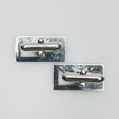 Silver-tone rectangular Swank cufflinks with Art Deco leaf and dot motif, mid-century vintage