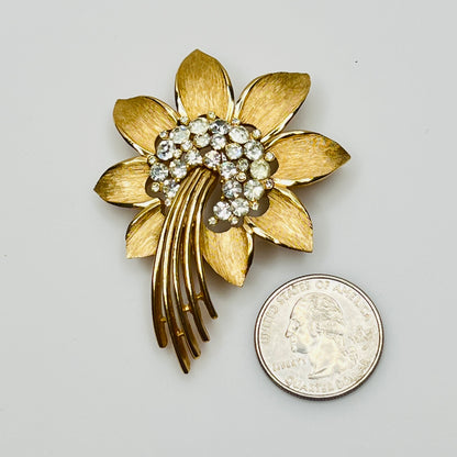 Trifari gold-tone floral brooch with rhinestone centers