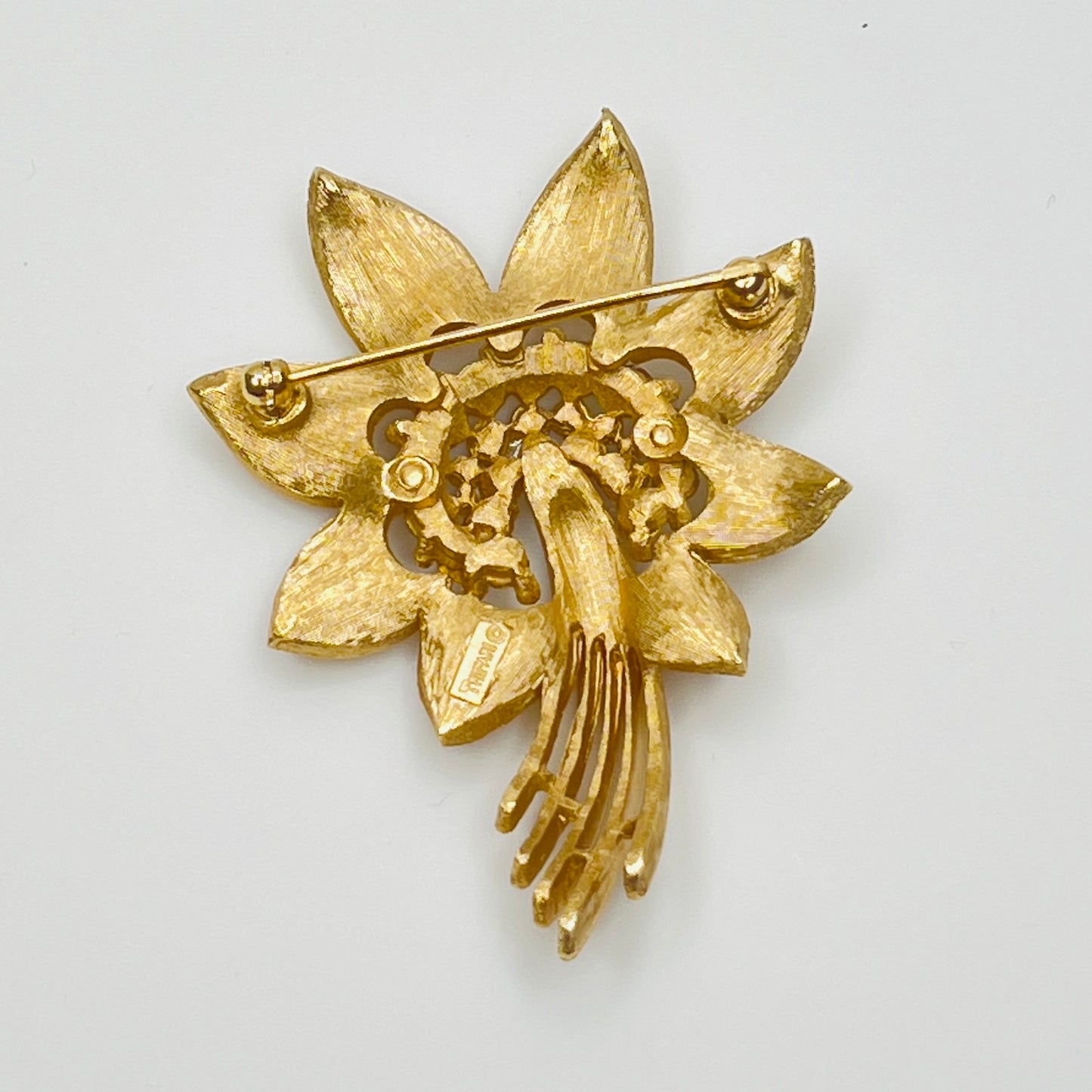 Trifari gold-tone floral brooch with rhinestone centers