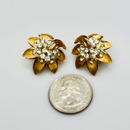 Trifari gold-tone floral clip-on earrings with rhinestone centers