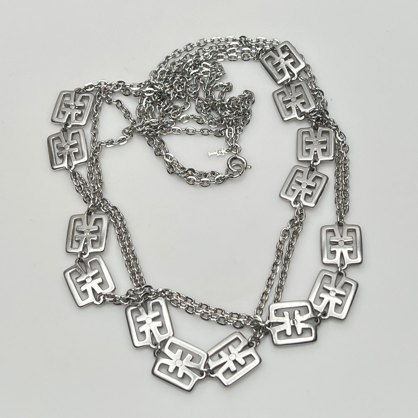 Detail of Trifari symbol hang tag and spring ring clasp