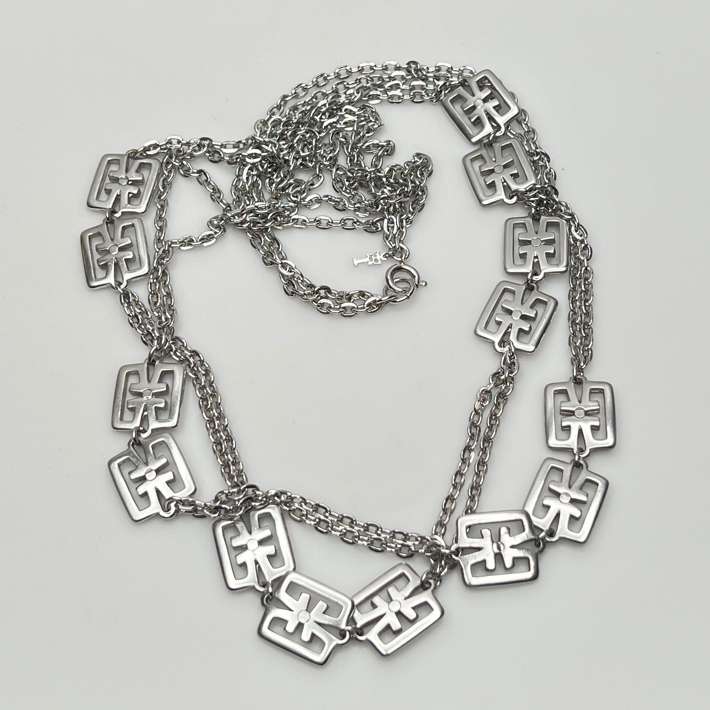 Detail of Trifari symbol hang tag and spring ring clasp