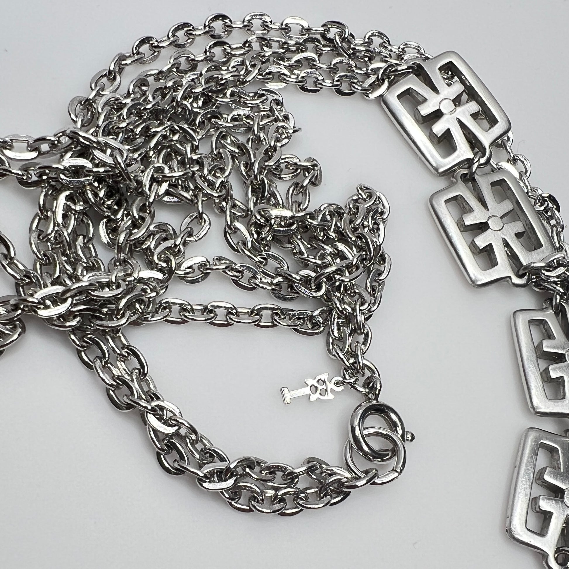 Detail of Trifari symbol hang tag and spring ring clasp