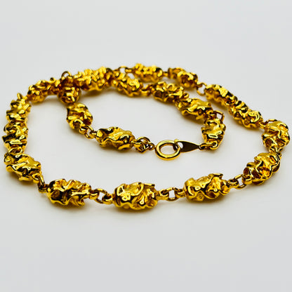 Vintage Trifari gold nugget necklace textured links close view