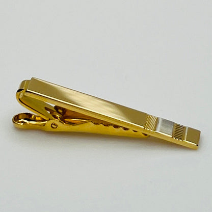 Mid-century gold and silver tone tie clip with minimalist stripe accents