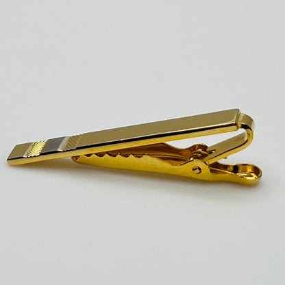 Mid-century gold and silver tone tie clip with minimalist stripe accents