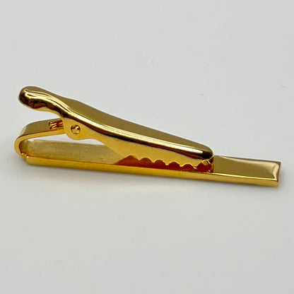 Mid-century gold and silver tone tie clip with minimalist stripe accents