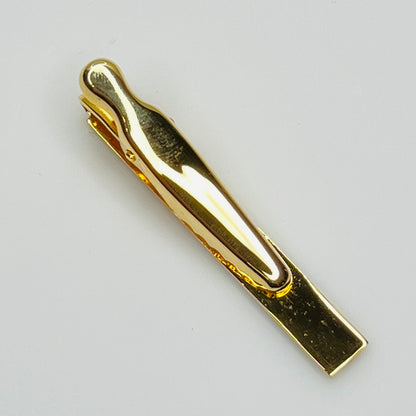 Mid-century gold and silver tone tie clip with minimalist stripe accents