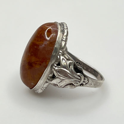 Side profile showing ornate sterling shoulders and bezel-set stone