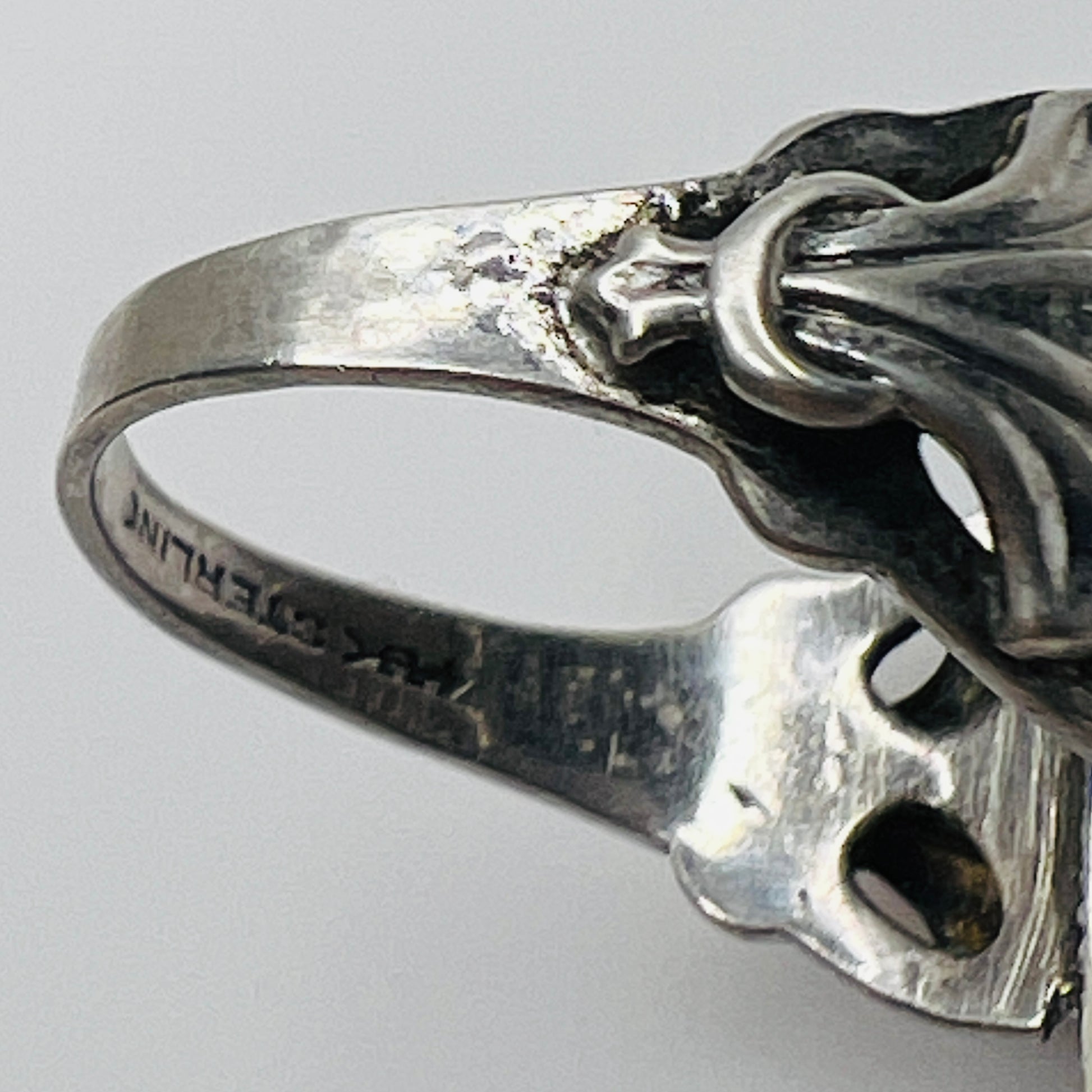 Interior band stamped "STERLING" with Uncas maker’s mark