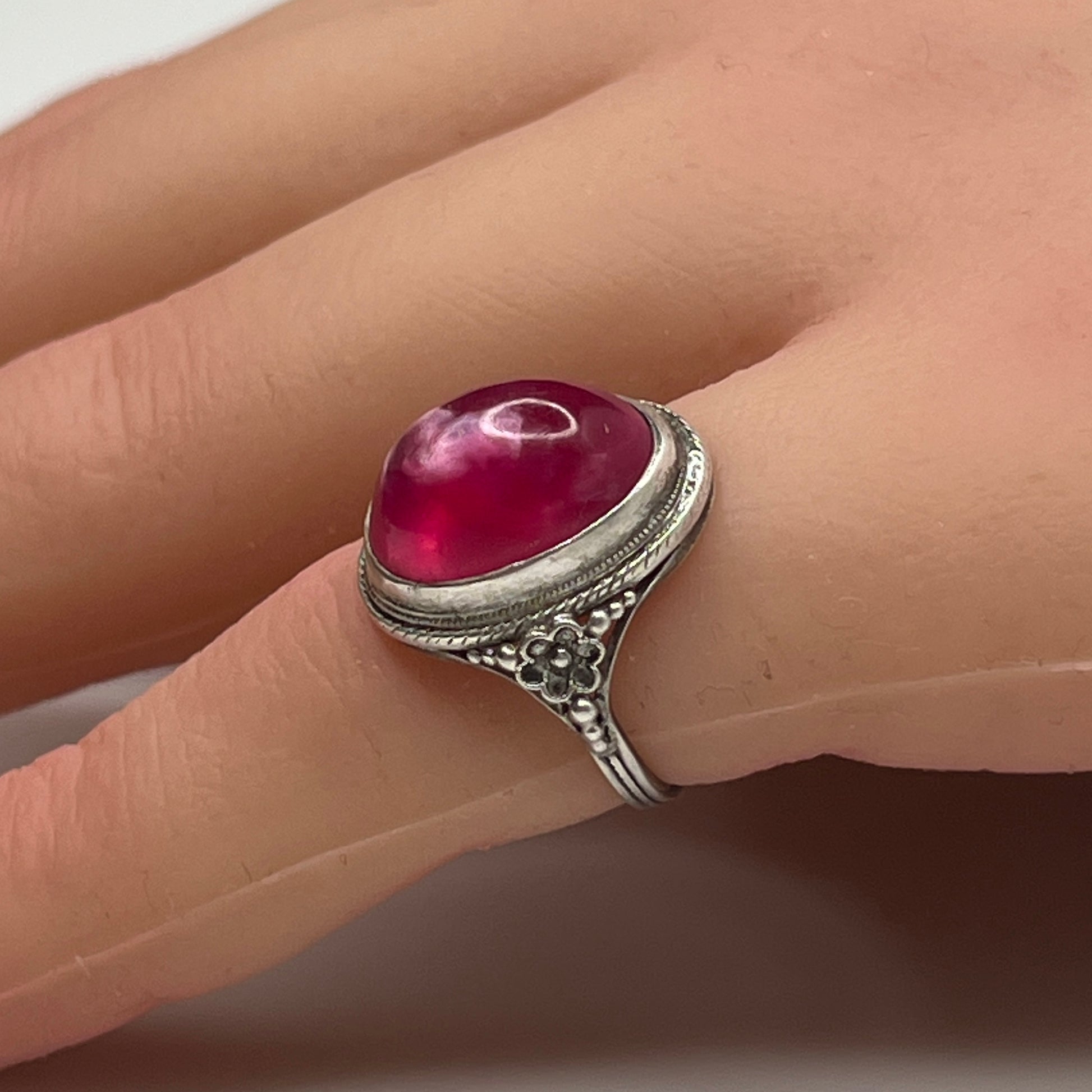Sterling silver Uncas ring with fuchsia pink cabochon on hand