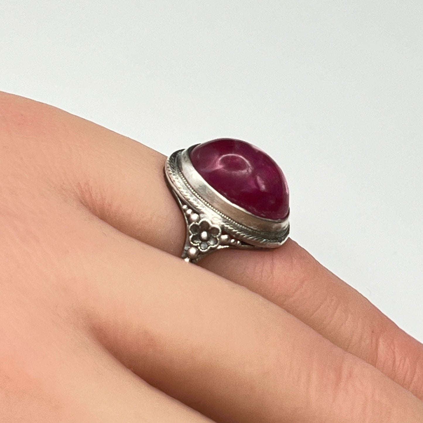 Sterling silver Uncas ring with fuchsia pink cabochon on hand