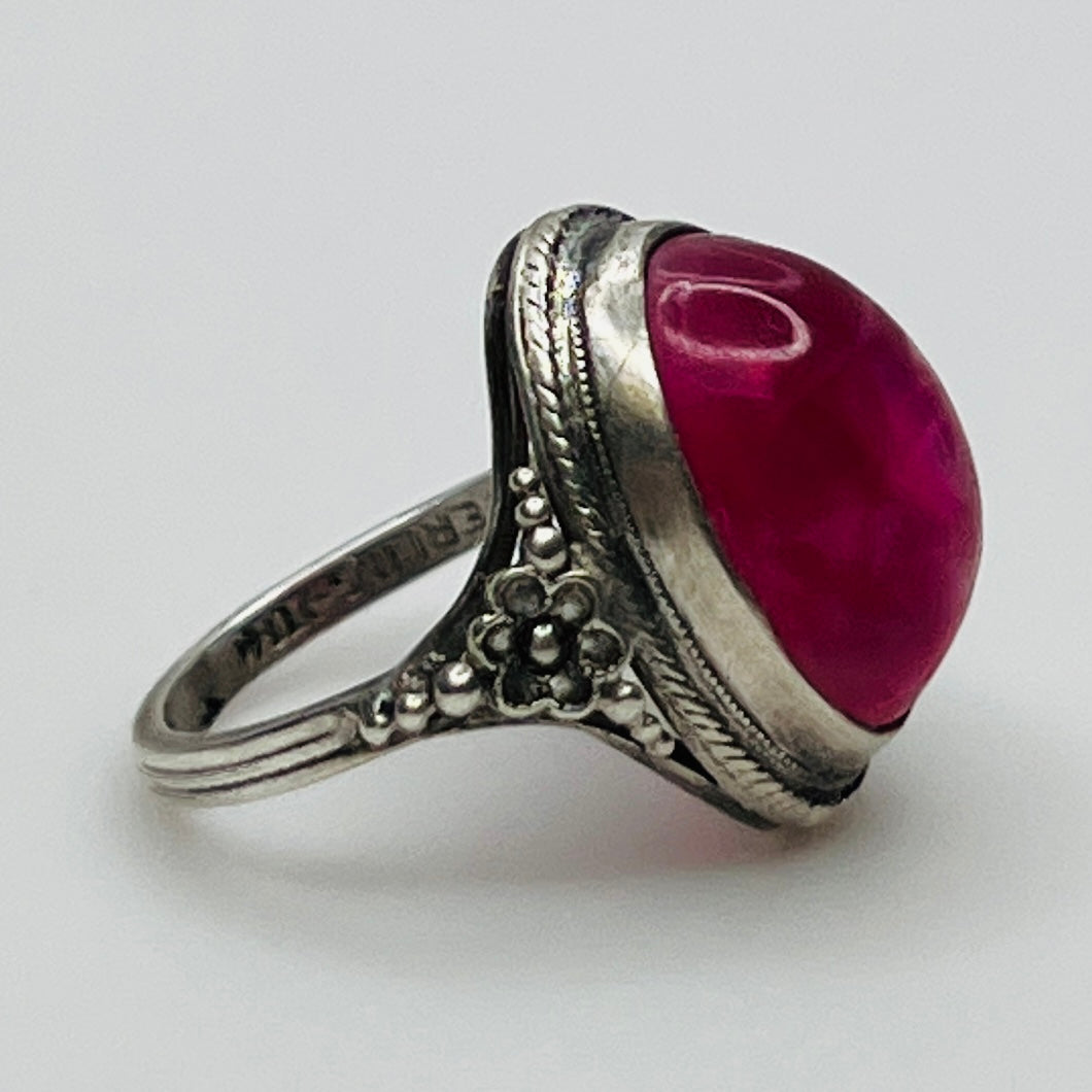 Side view of ring showing floral detail and stone setting