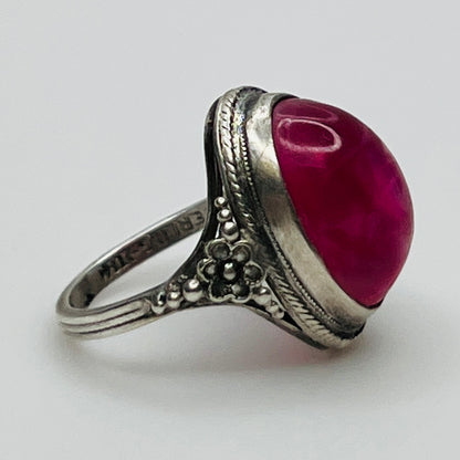 Side view of ring showing floral detail and stone setting