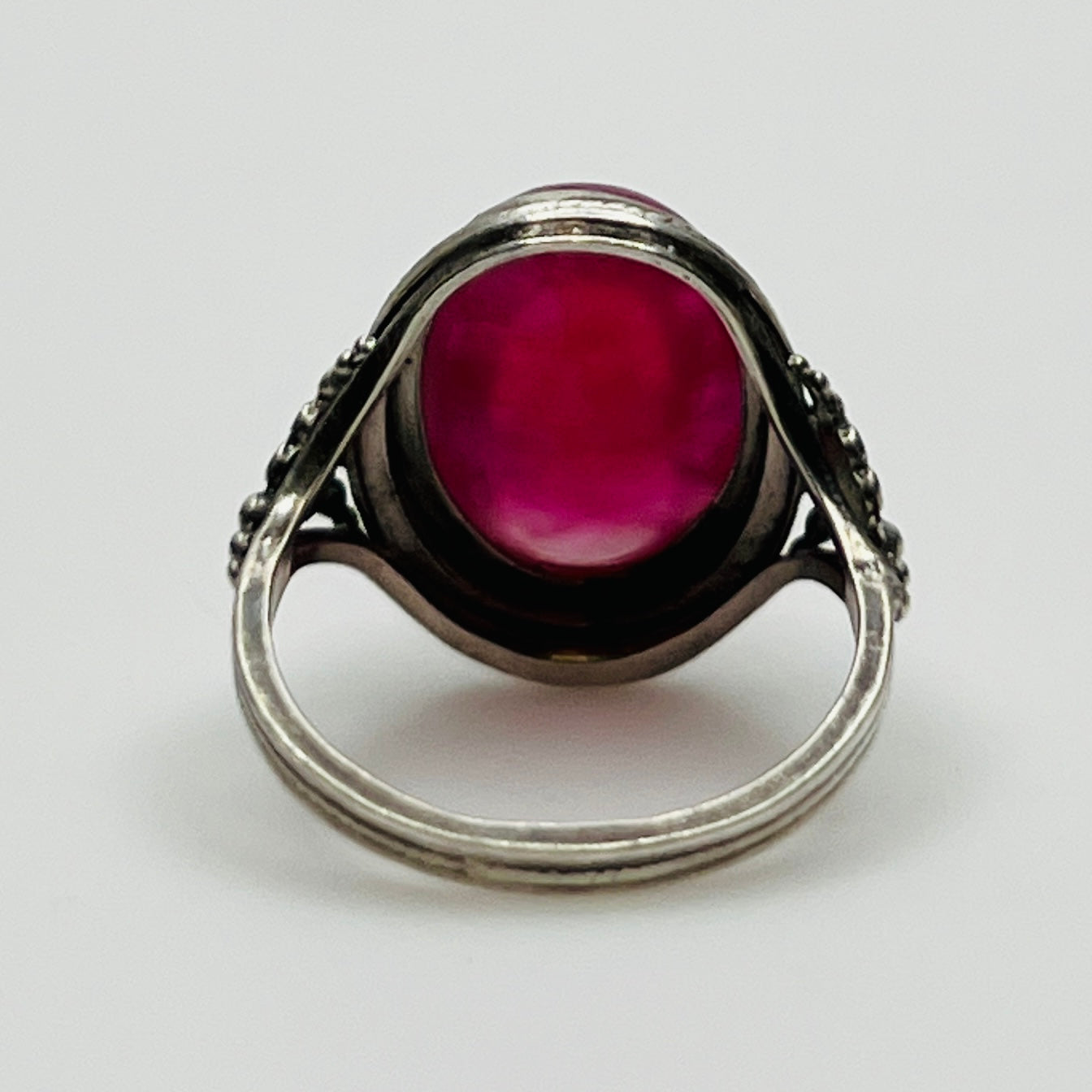 Back view of ring showcasing open setting and full cabochon