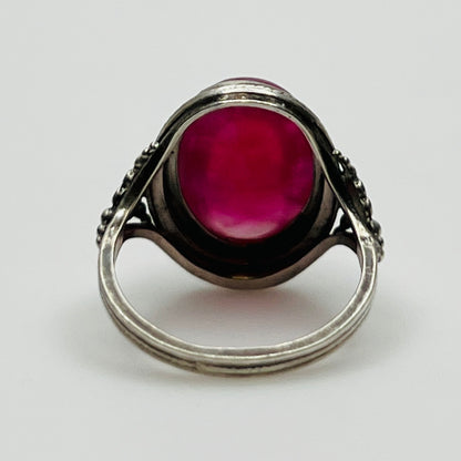 Back view of ring showcasing open setting and full cabochon