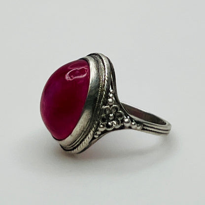 Side view of ring showing floral detail and stone setting