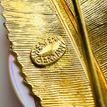 Close-up of Western Germany maker's mark stamped on reverse of vintage 1950s gold-tone mother of pearl leaf brooch.