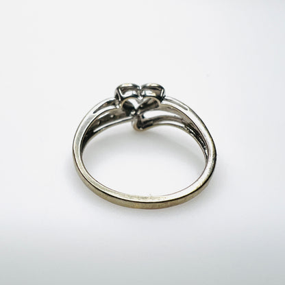 Side view of 10K white gold heart ring with diamond-set shoulders
