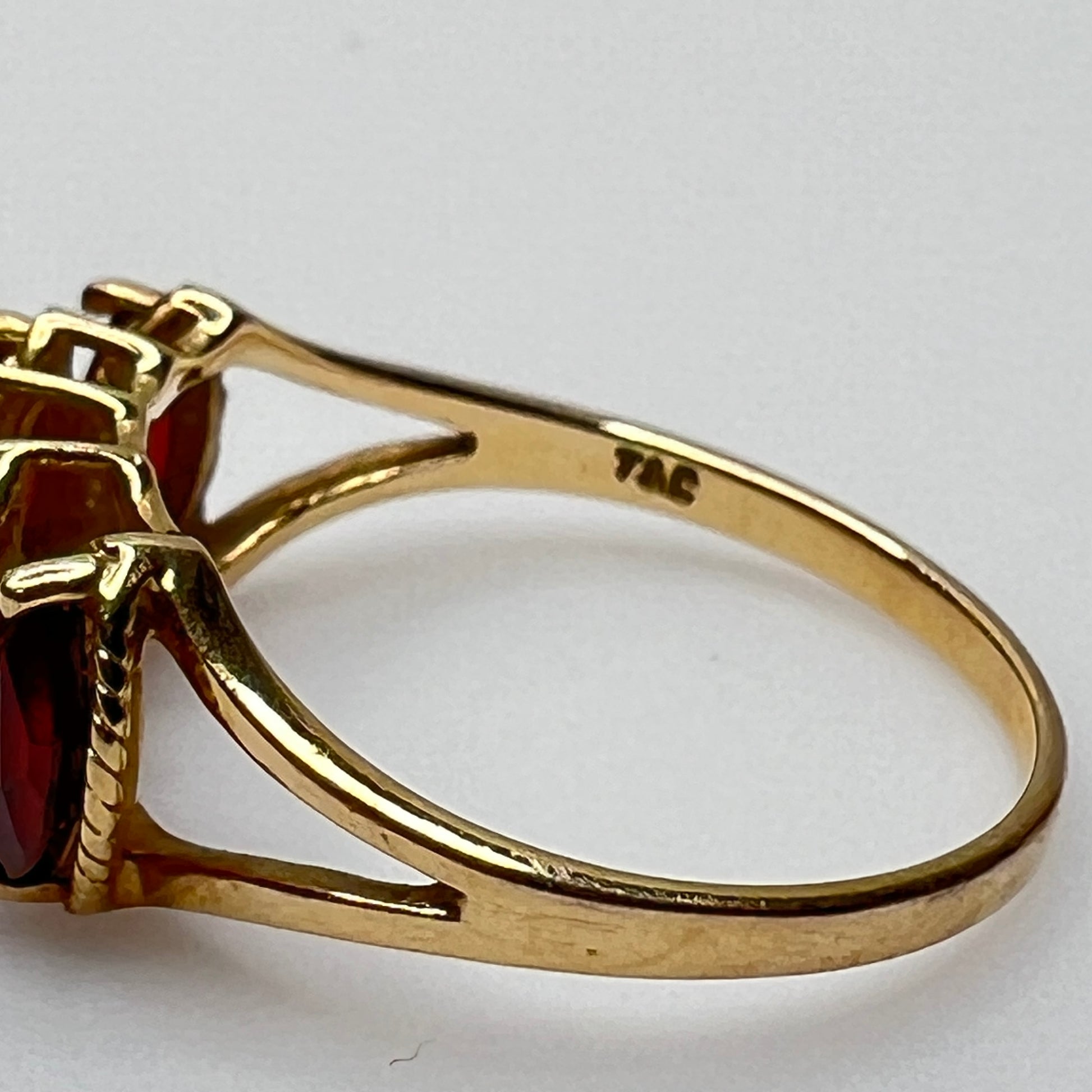 Rear view of ring with visible 10K and T&C stamp in gold band