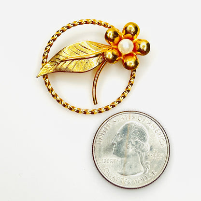 Vintage 12K gold filled pearl flower brooch shown beside quarter for scale