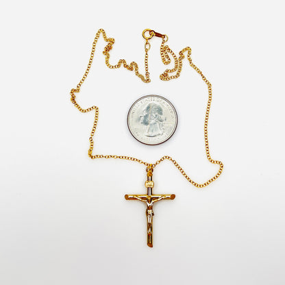 Vintage 14K gold filled crucifix necklace with quarter for size comparison.