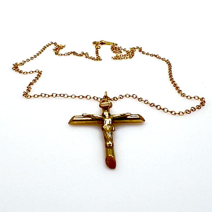 Side view of vintage gold filled crucifix pendant and matching chain.