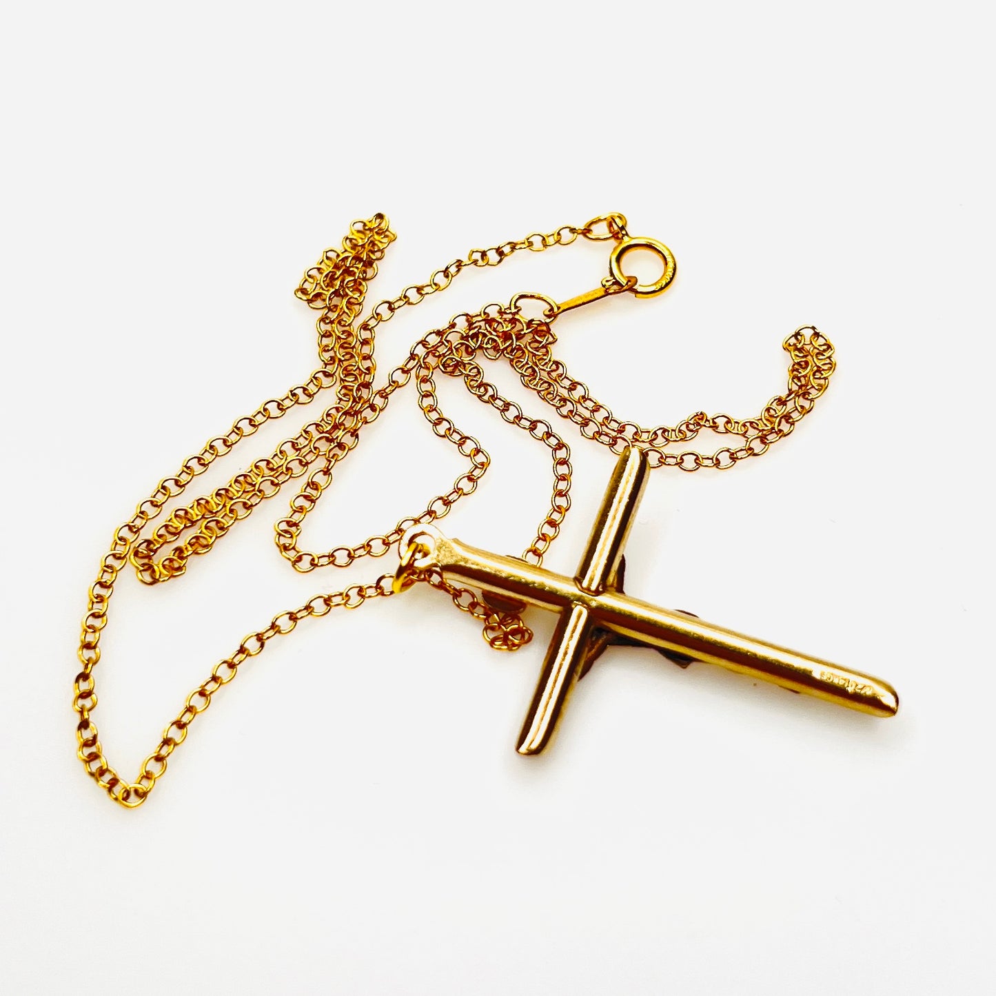 Reverse of vintage gold filled crucifix pendant and matching chain.
