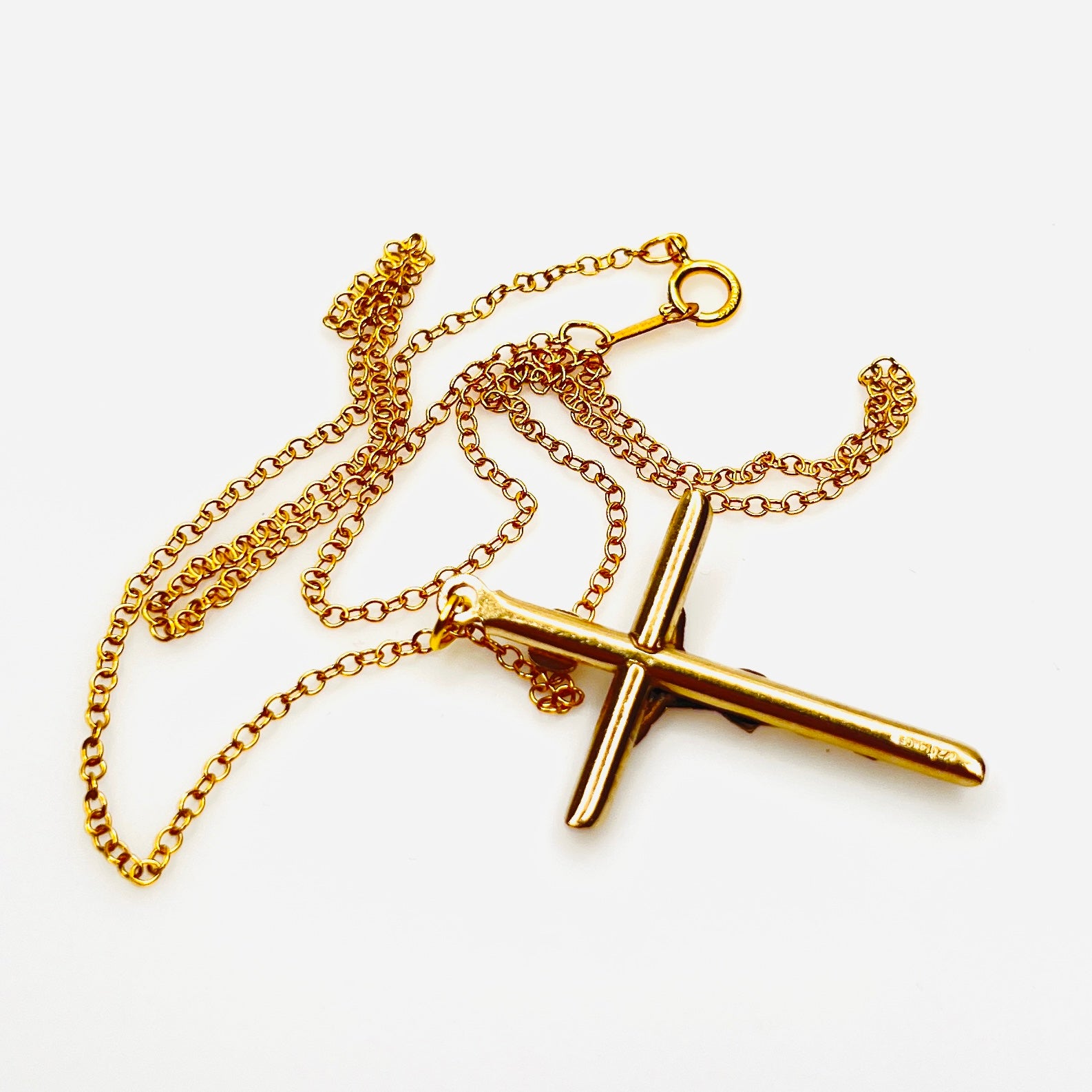 Reverse of vintage gold filled crucifix pendant and matching chain.