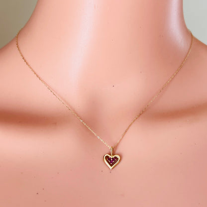 Vintage ruby heart necklace worn on mannequin dainty gold chain